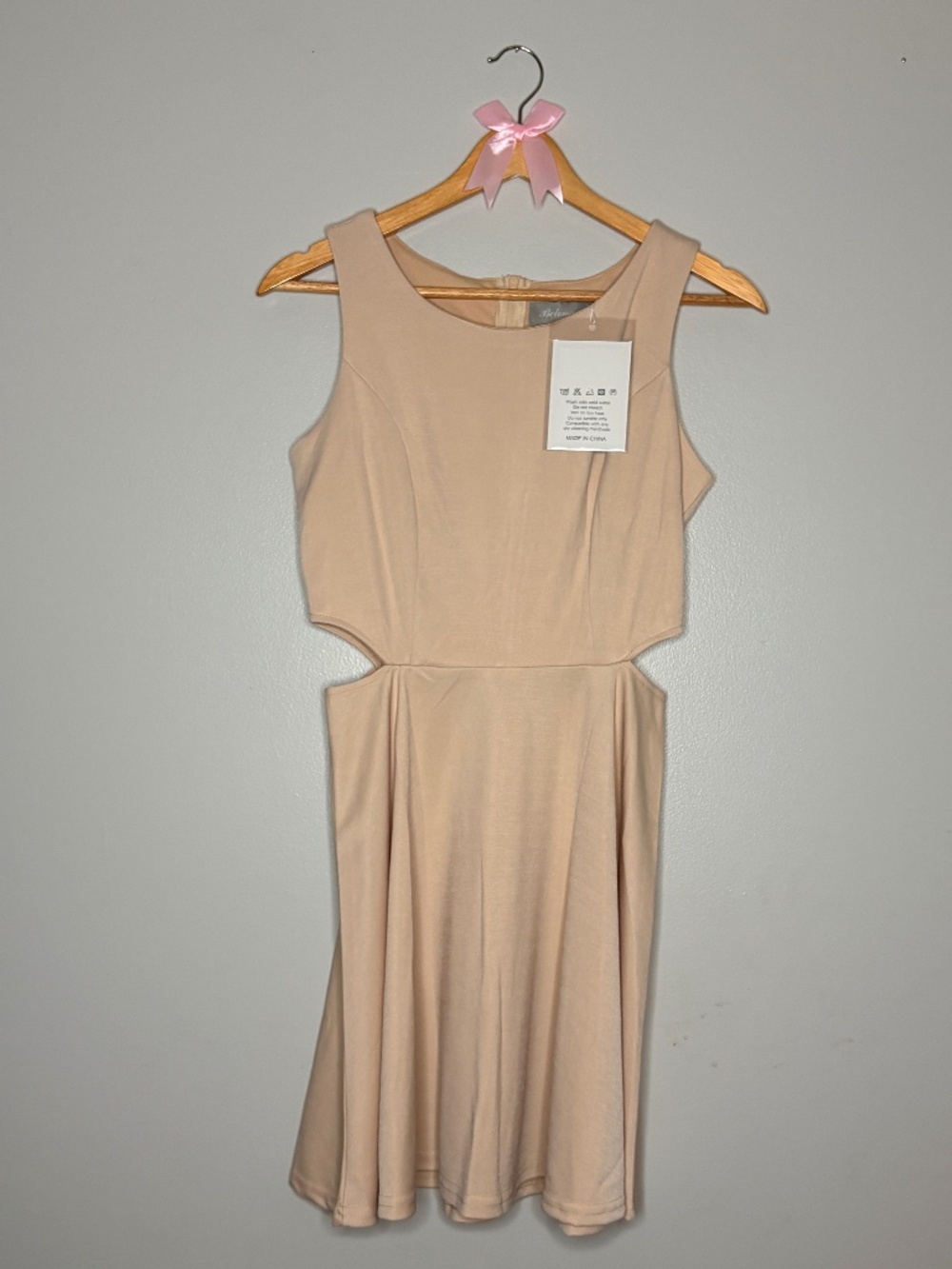 NWT tan dress with small cut outs on side size small